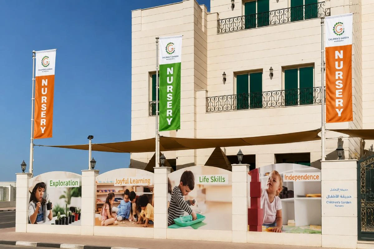 Decorative national flags displayed at an outdoor event venue with coordinated event branding