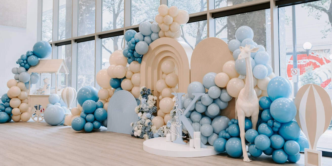 Beautifully decorated birthday celebration with balloons, themed décor, cake table, and festive event styling